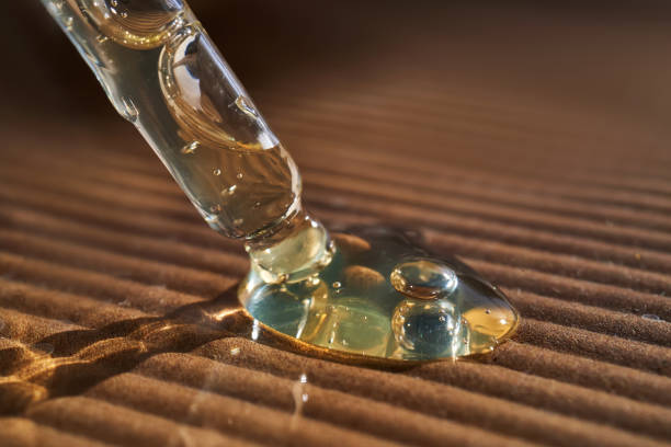 Pipette with serum on a corrugated surface. high quality photo.